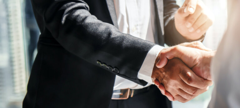 Employer shaking hands with contractor