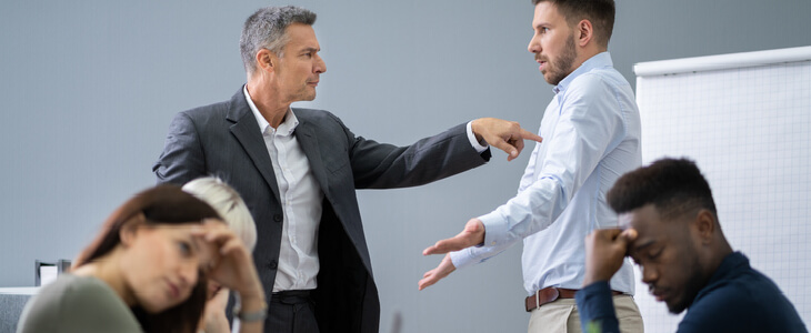 employees arguing in workplace creating a hostile workplace environment